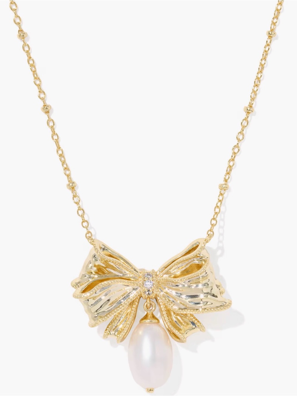 Kendra Scott x LoveShackFancy Pearl
Bow Gold Necklace & earrings set - Picture 7 of 8